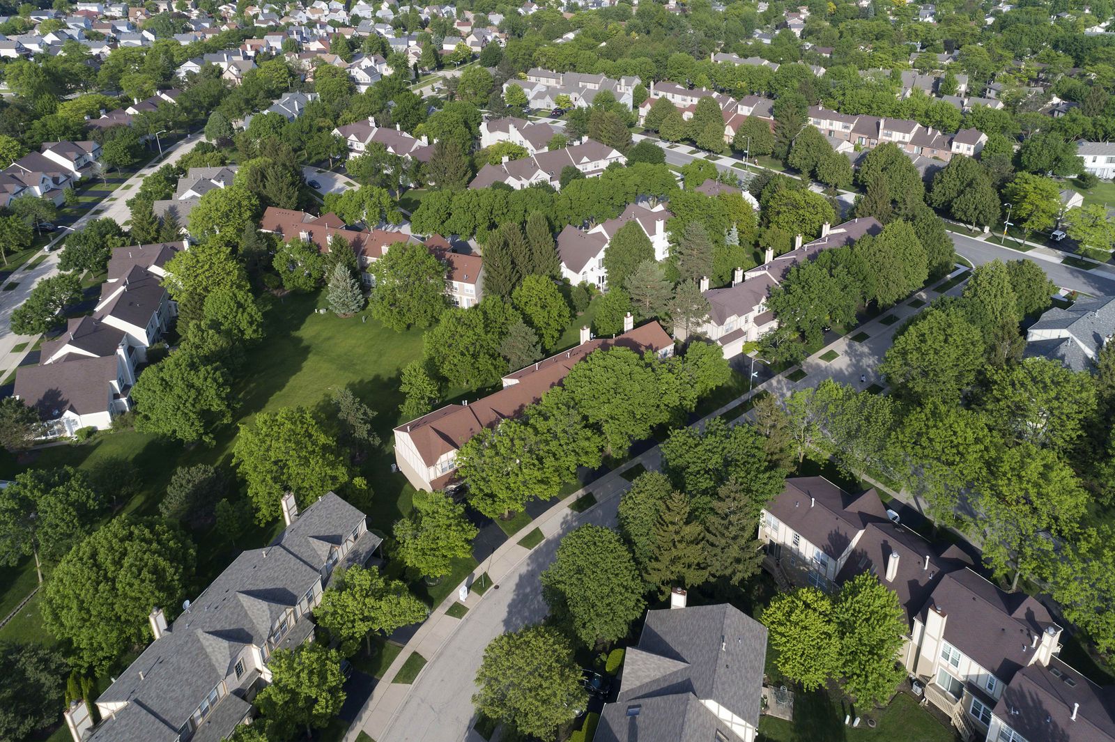 Aerial view of a townhouse row with new roofs